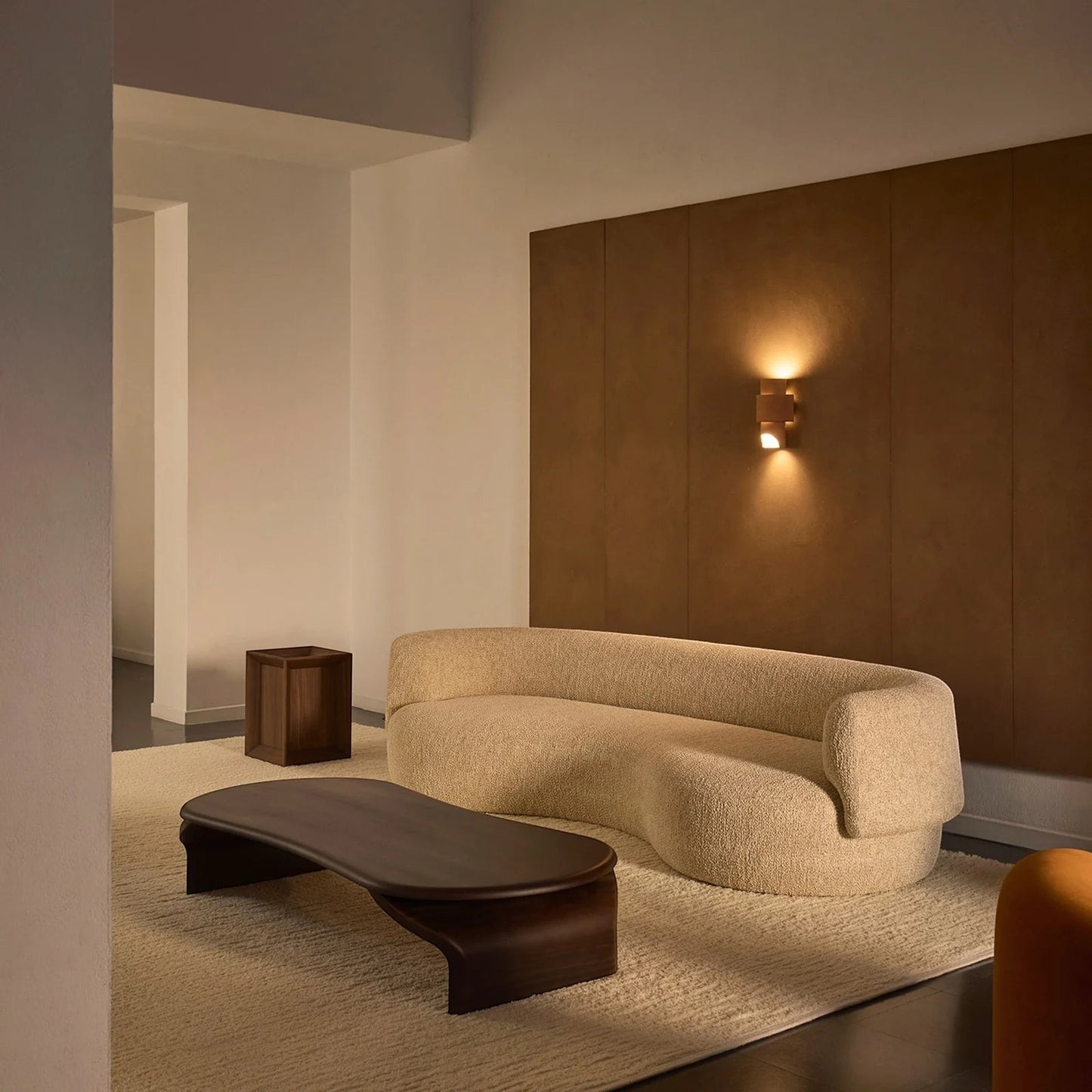 Ambrosia Concepts Angola 3-seater boucle fabric sofa in ivory, featuring a curved design and solid wood frame.
