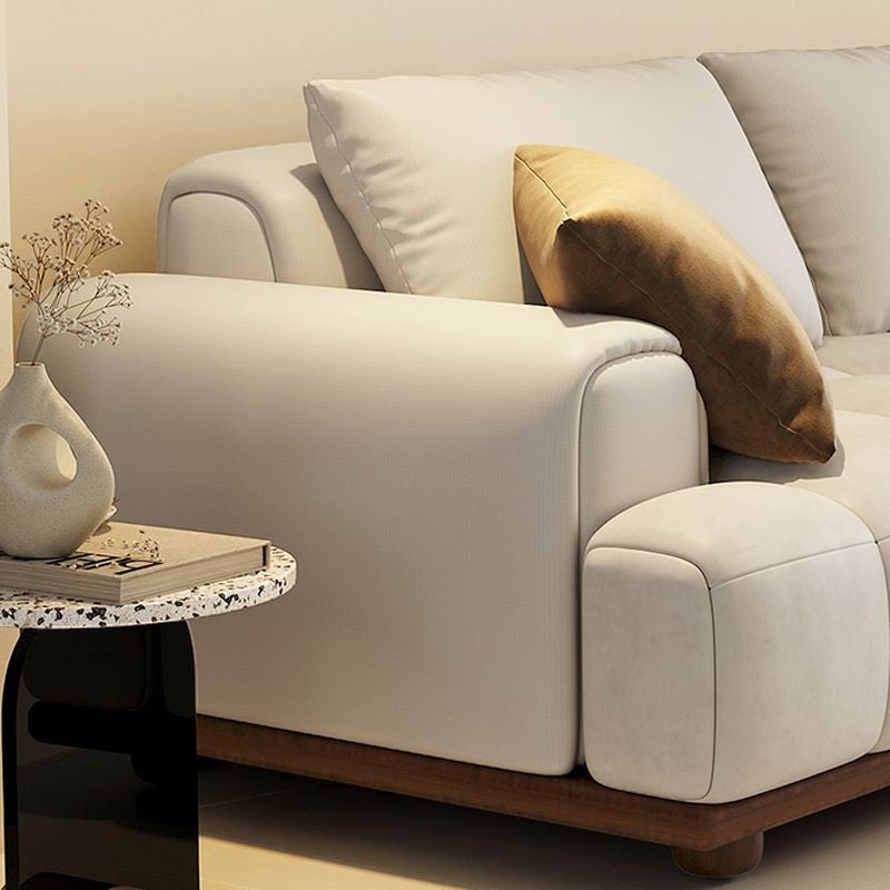 Ambrosia Concepts Padowa 3 Seater Sofa in off-white, featuring plush cushions and a modern low-profile design with a wooden base.
