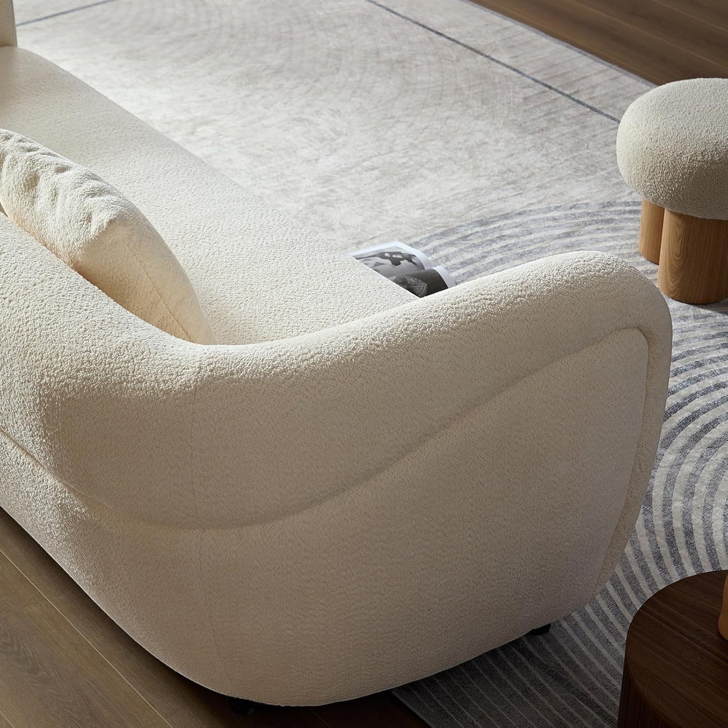 Ambrosia Concepts Symphony 3-seater sofa in cream boucle fabric with curved silhouette and plush cushioning.