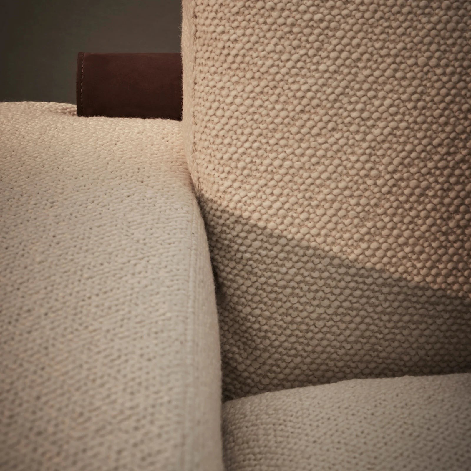 Ambrosia Concepts Elegenza 3-seater sofa in ivory boucle fabric with a dark brown leather accent tag.