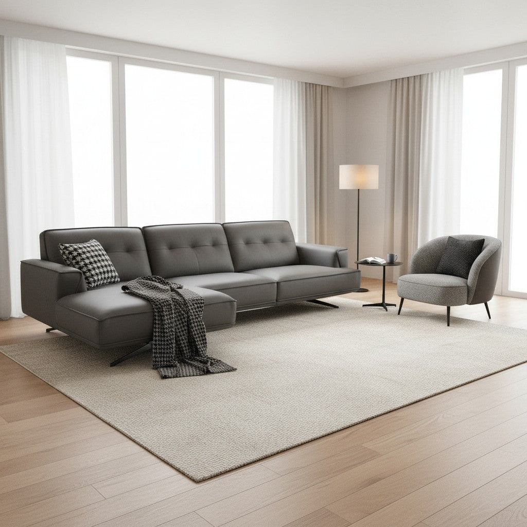 Ambrosia Concepts grey faux leather L-shaped sectional sofa with chaise and accent pillow.
