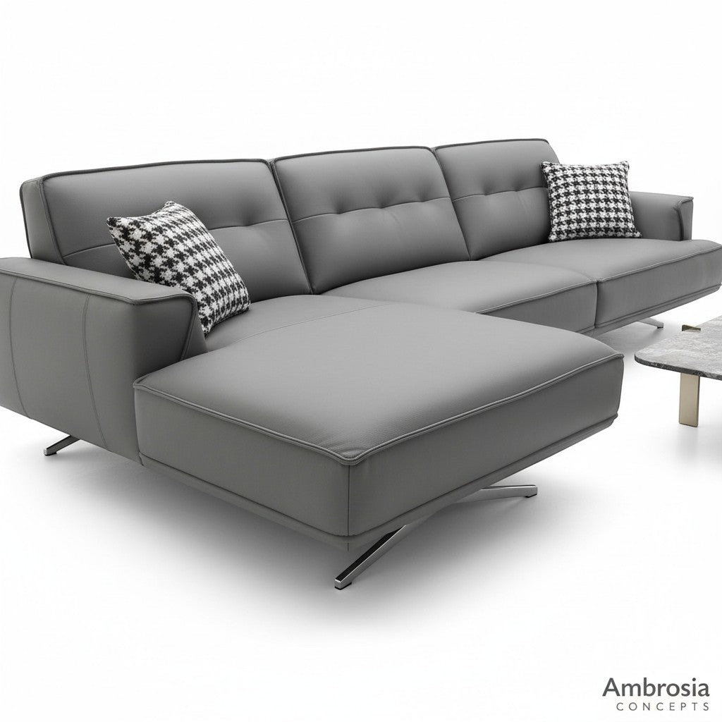 Ambrosia Concepts grey faux leather L-shaped sectional sofa with chaise and houndstooth pillows.