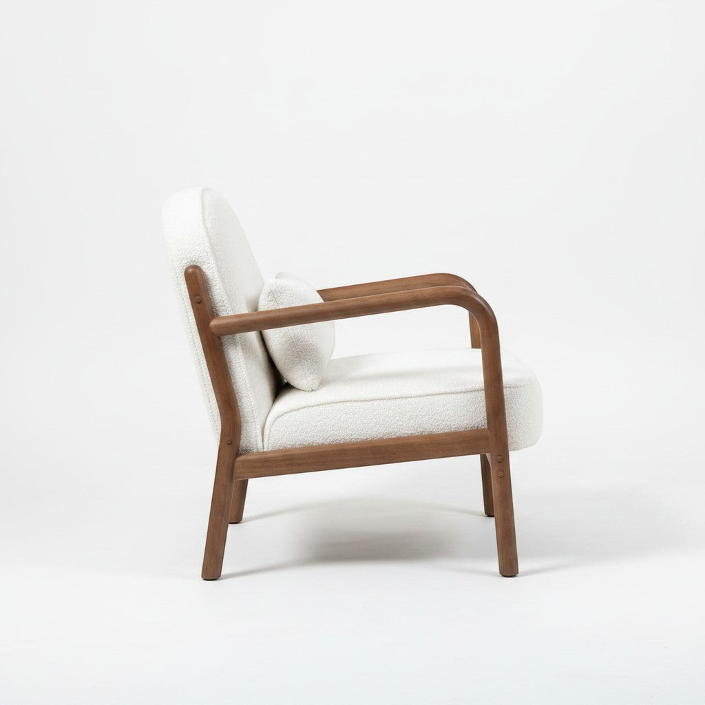 Ambrosia Concepts Kreta loungechair in white boucle fabric with curved walnut wood frame and accent pillow.