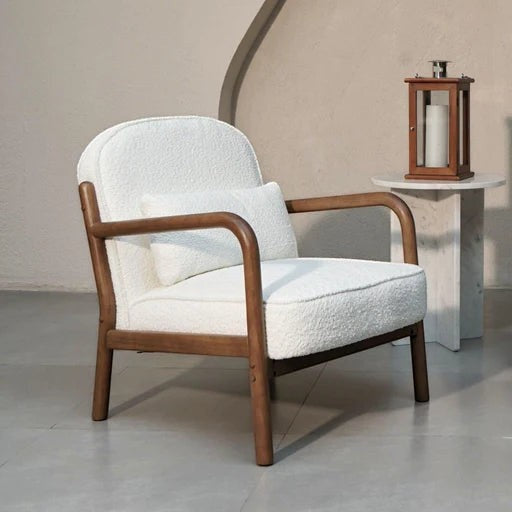 Ambrosia Concepts white boucle loungechair with curved walnut wood frame and accent pillow. Mid-century modern armchair.